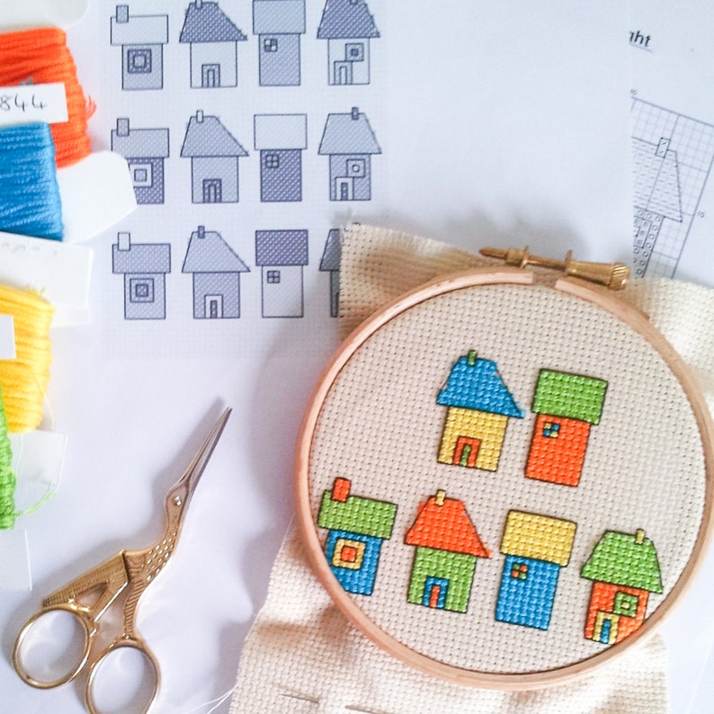 progress photos of embroidered modern cross stitch coloured cottages cross stitch