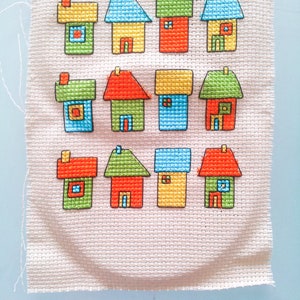 progress photos of embroidered modern cross stitch coloured cottages cross stitch