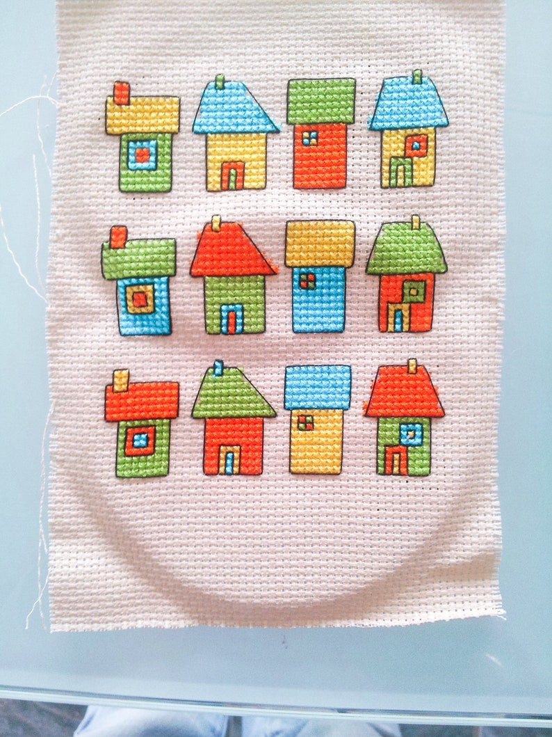 progress photos of embroidered modern cross stitch coloured cottages cross stitch