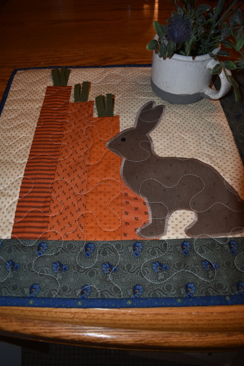 Primitive Bunny and Carrots on this Wall Warmer measuring about 18 x 18