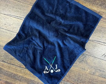 Gepersonaliseerde golfhanddoek: geborduurde initialen en clubs