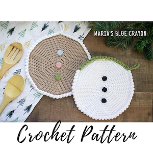 May include: Two crocheted pot holders, one shaped like a gingerbread man with brown, green, pink, and blue accents, and the other shaped like a snowman with white, green, and black accents.  "Crochet Pattern" is written below the pot holders.