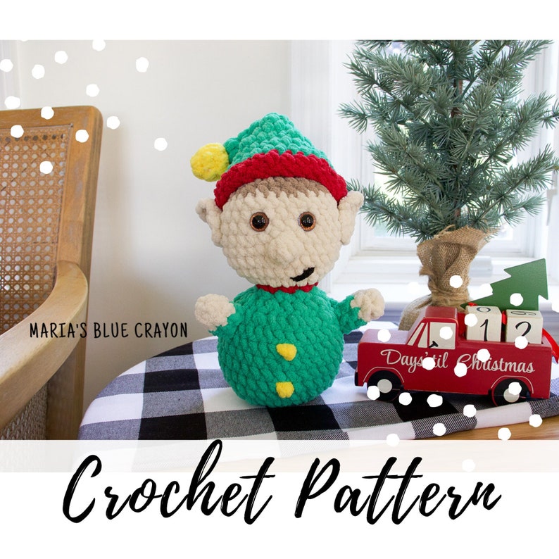 crochet elf sitting on a festive table next to a tree. "Crochet Pattern"