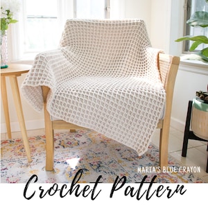 May include: A cream-colored crochet blanket draped over a wooden chair. The blanket features a textured, waffle-like pattern. The words "Crochet Pattern" are written in a script font at the bottom of the image, with "Maria's Blue Crayon" in the corner.