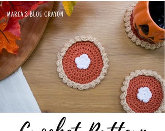 May include: Handmade crochet coasters in a pie design. The coasters are rust-colored with a tan crust and a white flower in the center. The text "Maria's Blue Crayon" and "Crochet Pattern" are also visible.