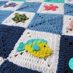 May include: A crocheted baby blanket with a blue, white, and green color scheme. The blanket features various sea creatures, including a yellow fish, a green turtle, a pink jellyfish, and a purple octopus. The blanket is made with a variety of stitches and textures.