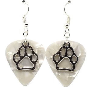 May include: A pair of silver dangle earrings with a white guitar pick shaped charm featuring a silver paw print cutout.