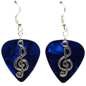 May include: A pair of blue guitar pick earrings with a silver treble clef charm.
