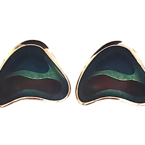 May include: A pair of stud earrings featuring a triangular, rounded shape with a gold-toned metal border. The center of each earring displays a layered, abstract design with deep blue, forest green, and dark maroon enamel sections.