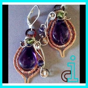 May include: A pair of earrings featuring amethyst gemstones wrapped in copper wire. The earrings have a teardrop-shaped amethyst gemstone surrounded by copper wire and smaller green and blue gemstones.
