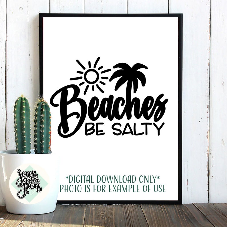 May include: Black and white printable design with a sun, palm tree, and the text "Beaches Be Salty". The design is framed and displayed on a white wall.