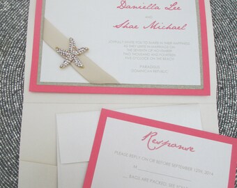 May include: Pink and white wedding invitation with a gold starfish and a white ribbon. The invitation reads "Daniella Lee and Shae Michael joyfully invite you to share in their happiness as they unite in marriage on the seventh of November two thousand and fourteen five o'clock on the beach Paradisus Dominican Republic". The RSVP card reads "Response Please reply on or before September 12th, 2014 M Bags are packed. See you there! # of adults We'll be celebrating from home!"