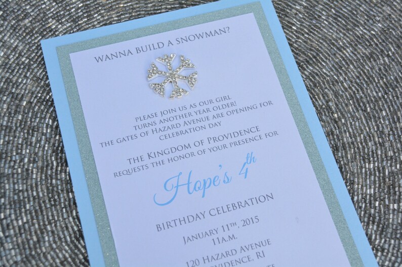 May include: A blue and white invitation with a snowflake design. The invitation is for Hope's 4th birthday celebration. The event will be held on January 11th, 2015 at 11:00 AM at 120 Hazard Avenue in Providence, Rhode Island.