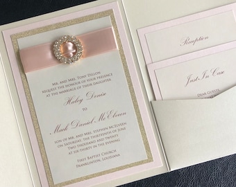 May include: A wedding invitation with a pink ribbon and a rhinestone embellishment. The invitation is for Haley Denix and Mack Daniel Mc Elveen. The wedding will be held at First Baptist Church in Franklinton, Louisiana on June 13, 2020 at 6:30 PM.