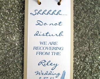 May include: A tan card with blue text that reads "Shhhhh... Do not disturb. We are recovering from the Riley Wedding 2.27.15". A blue starfish is in the bottom right corner.