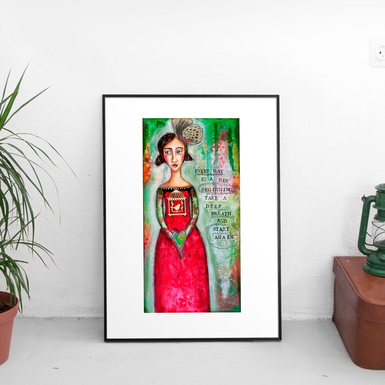 May include: A colorful painting of a woman in a red dress holding a birdcage. The background is green and the text reads "Every day is a new beginning. Take a deep breath and start again."