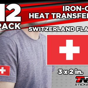 May include: A pack of 12 iron-on heat transfers featuring the Swiss flag. Each transfer is 3 inches by 2 inches. The transfers are shown on a gray t-shirt.