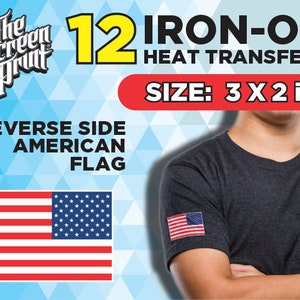 May include: A pack of 12 iron-on heat transfers featuring a reverse side American flag design. The transfers are 3 inches by 2 inches. The image shows a person wearing a dark grey t-shirt with the iron-on transfer on the sleeve.