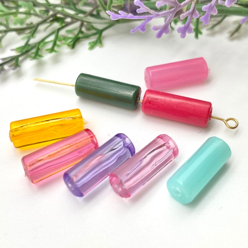 May include: Assortment of colorful glass beads in various shapes and sizes. The beads are perfect for jewelry making, crafting, and other DIY projects.