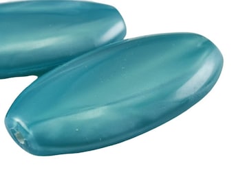 May include: Two teal blue oval-shaped beads with a glossy finish.