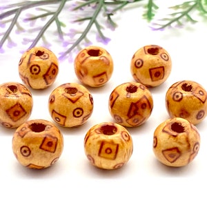 10mm Wooden Round Beads with Patterns. Pack of 20. High quality, lightweight and durable beads perfect for crafting.