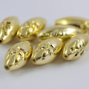 8 pcs Ornamented Golden Plastic Beads . 37x15 mm . Vintage German Beads , Lucite Beads  - bk121