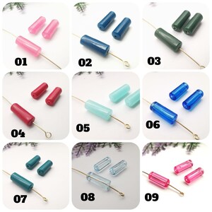 May include: Nine different colors of glass beads, each with a different color and shape. The beads are arranged in rows of three, with each row labeled with a number from 01 to 09. The beads are all about 1 inch long and 1/4 inch wide.