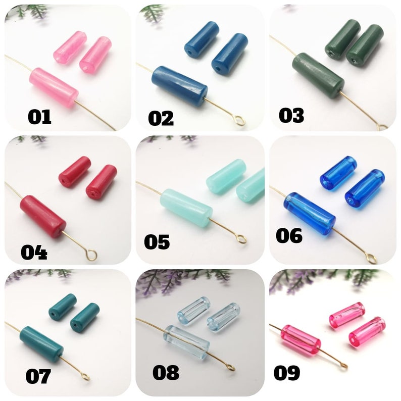 May include: Nine different colors of glass beads, each with a different color and shape. The beads are arranged in rows of three, with each row labeled with a number from 01 to 09. The beads are all about 1 inch long and 1/4 inch wide.