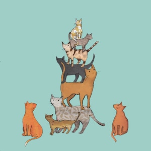 CATALYTIQUE . 9 chats de couleurs différentes faisant un numéro d' équilibre , juste parce que ... et bien pourquoi pas ? Une carte imprimée à partir d' un collage original .