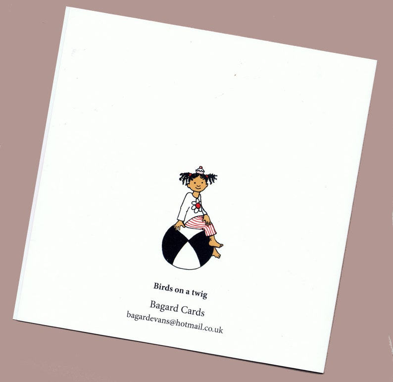 May include: A black and white illustration of a girl with a flower on her shirt sitting on a beach ball. The text "Birds on a twig" and "Bagard Cards" is below the illustration. The email address "bagardevans@hotmail.co.uk" is below the text.