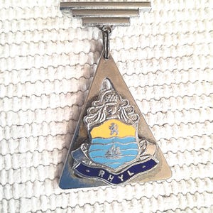 B35 Art deco souvenir of Rhyl, Wales. Very "military" style, would look great with a steam punk look. Tracked shipping.