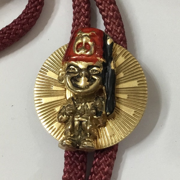 K9 Vintage Shriners (Masonic link) Bolo with bullet tipped fabric cord. Dating from 60/70’s, Originally from the USA. Free tracked shipping.