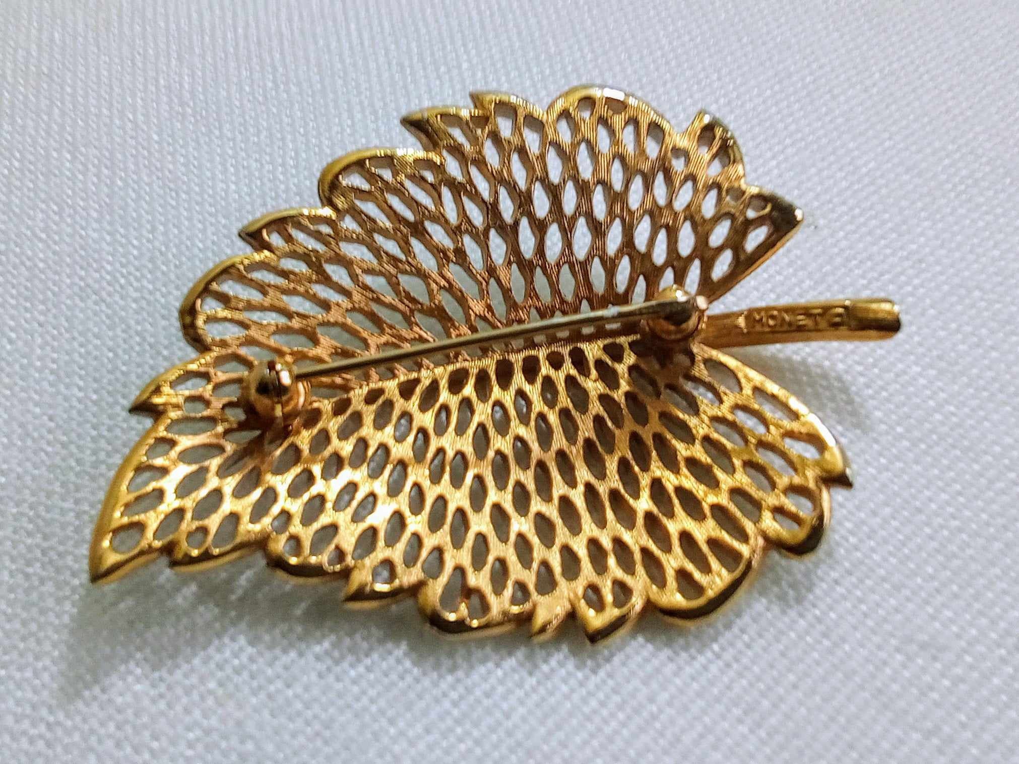 JP37. Vintage Monet Gold Tone and White Enamel Leaf Brooch