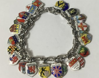 S47 Vintage Silver shield charm bracelet with 26 charms. Free tracked shipping.