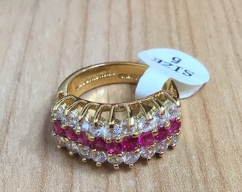 J10 New, old stock, vintage Lind 14K gold plated, synthetic rubies and Faux diamond ring size US5. Low cost tracked shipping.