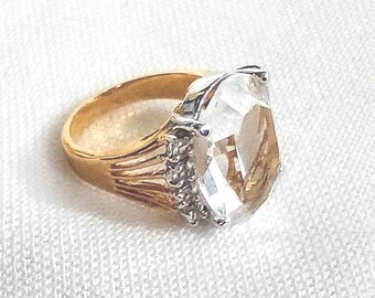 J29 Eyecatching Vintage Statement Pinky Ring (small). Large Clear Center Stone with Clear Stone Accents. Gold Plated Mount. Tracked Shipping