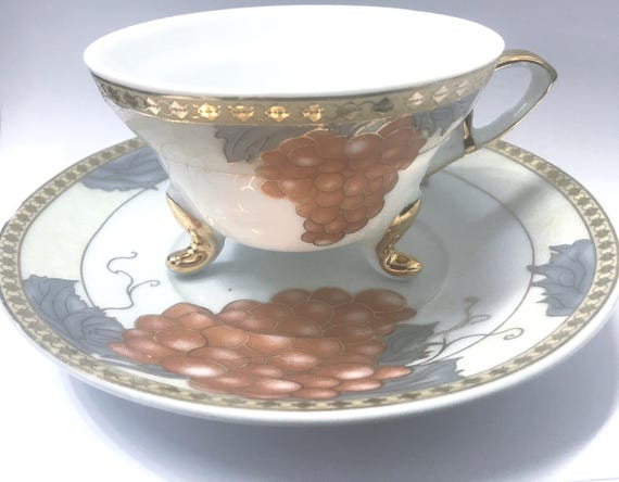 L18 Extremely Rare, Beautiful Tri-footed Cup and Saucer Made in