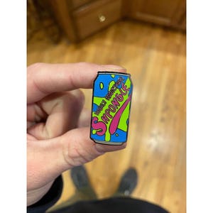 Shpongle Pin Slurm Can From Cartoon Futurama Spuds Mckenzie Hat Pin