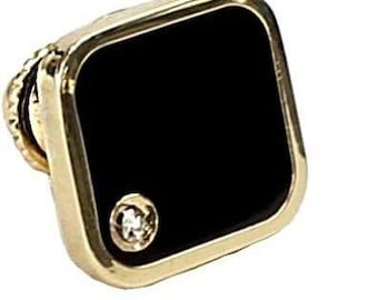 May include: A gold-toned square pin with a black onyx center and a single diamond accent.