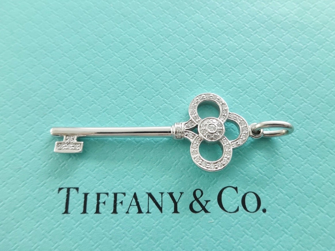 Tiffany Keys mini crown key pendant in 18k gold with diamonds.