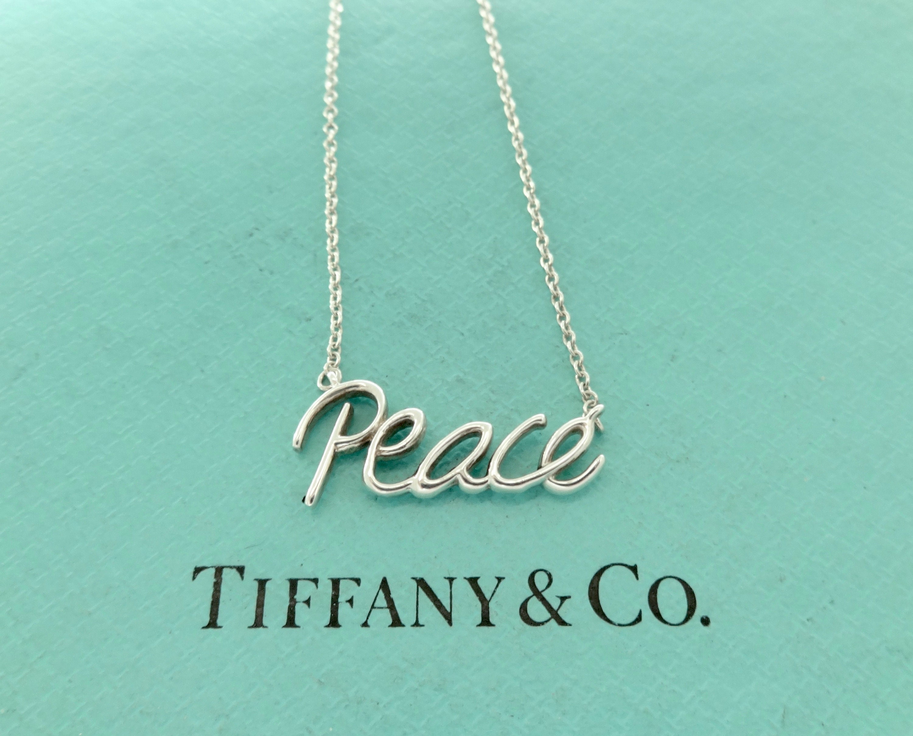 Tiffany peace necklace deals