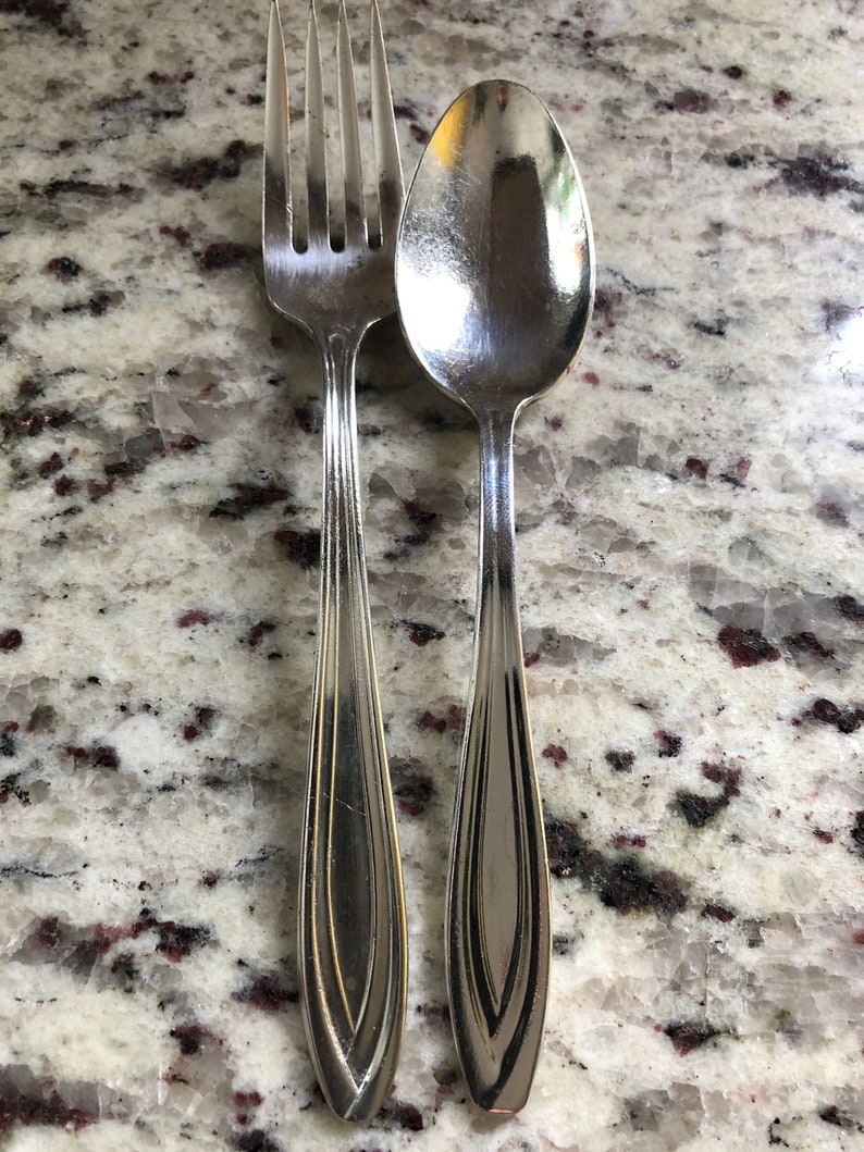 Airline utensils from National Airlines qty 2 set with fork and spoon by the International silver company a rare and unusual defunct airline