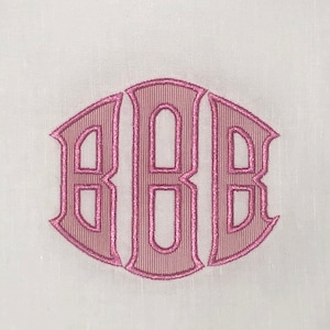 May include: A pink embroidered monogram with the letters "BBB" in a traditional script font.