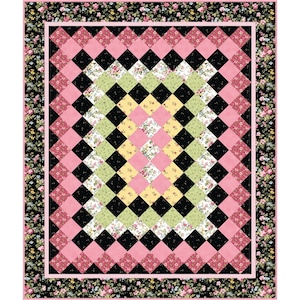 May include: A quilt with a black, pink, green, and yellow diamond pattern. The quilt is surrounded by a floral border.
