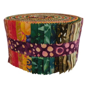 May include: A roll of fabric featuring a variety of batik prints in shades of orange, yellow, green, and purple. The fabric is rolled up and tied with a purple and pink batik ribbon.