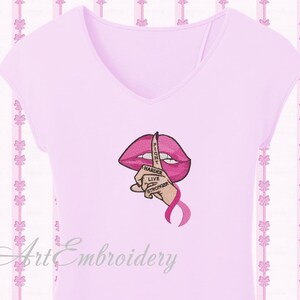 May include: Pink t-shirt with an embroidered design of a pink mouth with a finger over it. The finger has the words "Fight Harder Live Stronger" written on it. There is a pink ribbon below the finger.