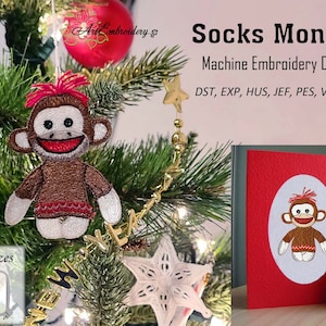 May include: Machine embroidery design of a brown sock monkey with red hair, available in two sizes: 4x4 and 5x5 inches. The design is shown on a Christmas tree ornament and a red card.