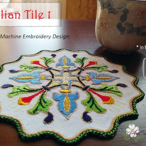 May include: Machine embroidery design of an Italian tile pattern in three sizes: 5x5 inches, 6x6 inches, and 8x8 inches. The design features a colorful floral motif with green leaves, red and yellow flowers, and blue and white accents.