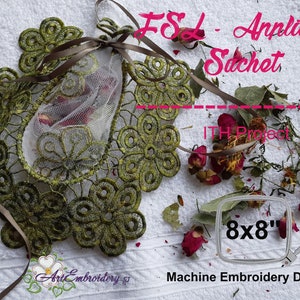 May include: Green lace applique sachet with a brown ribbon and dried flowers. The sachet is 8x8 inches and is a machine embroidery design.