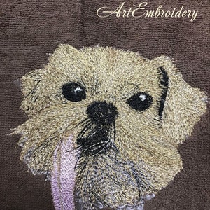 May include: Embroidered image of a brown and white dog with a pink feather in its mouth. The image is on a brown fabric background. The text "Art Embroidery" is in the upper right corner of the image.